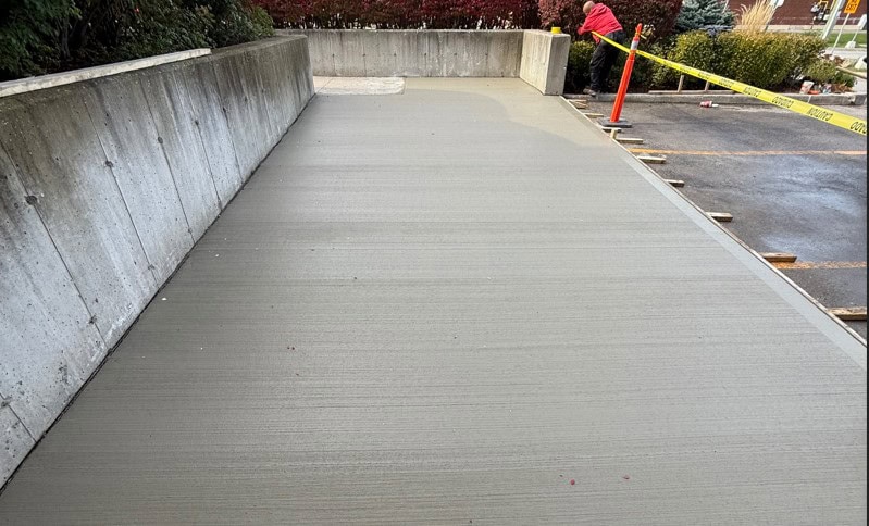 Concrete sidewalk installation by Tera Core Construction in progress.